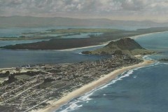 Aerial view of Mount Maunganui and Mauao, with Matakana Island in the background.