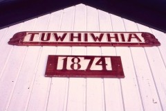 Tūwhiwhia wharenui name and 1874 date marker at Ōpureora Marae.